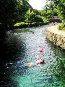People snorkeling in one of the subterranean rivers