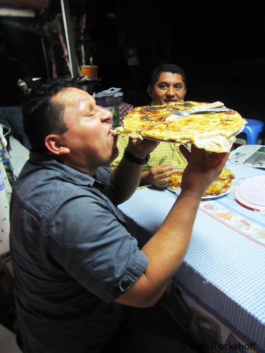 My husband taking a bite of his pupusa loca, Ahuachapan, El Salvador