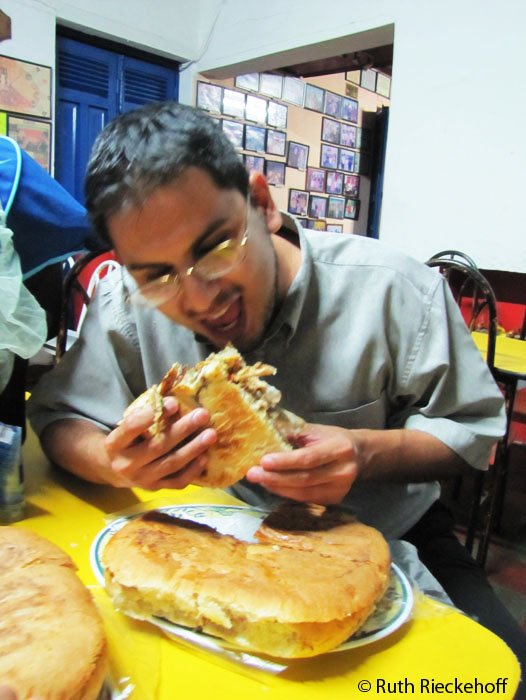 Our friend Daniel eating his torta loca, Restaurante La Antorcha, Santa Ana, El Salvador