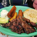 Grilled meat, chorizo, pupusa, plantain, cheese and avocado