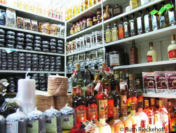 Mole and other goods for sale in the Mercado Benito Juarez, Oaxaca, Mexico