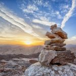 Every Corner, Stack of rocks seen at sunset, Break the Routine and Add Adventure to your Life
