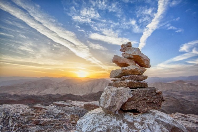 Every Corner, Stack of rocks seen at sunset, Break the Routine and Add Adventure to your Life