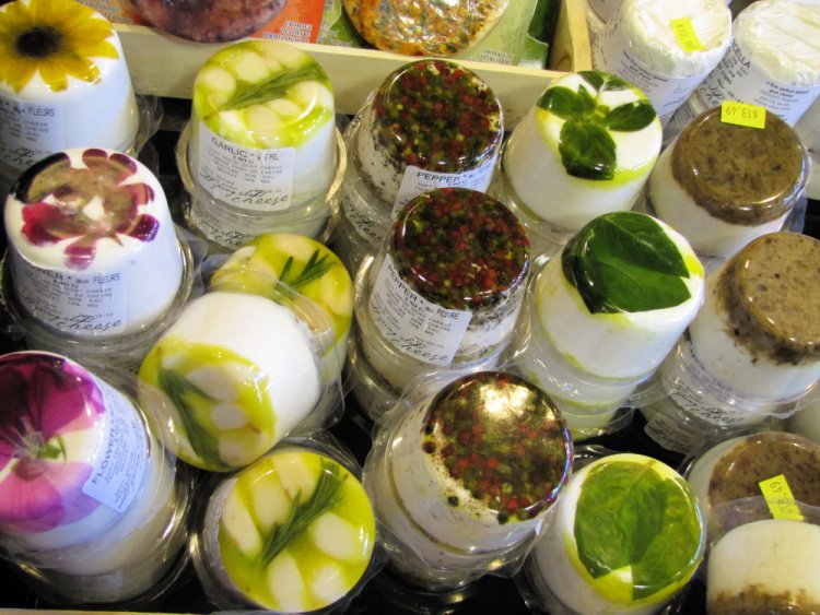 Goat Cheese with flowers, herbs and seeds at the bottom, Granville Island Public Market, Vancouver