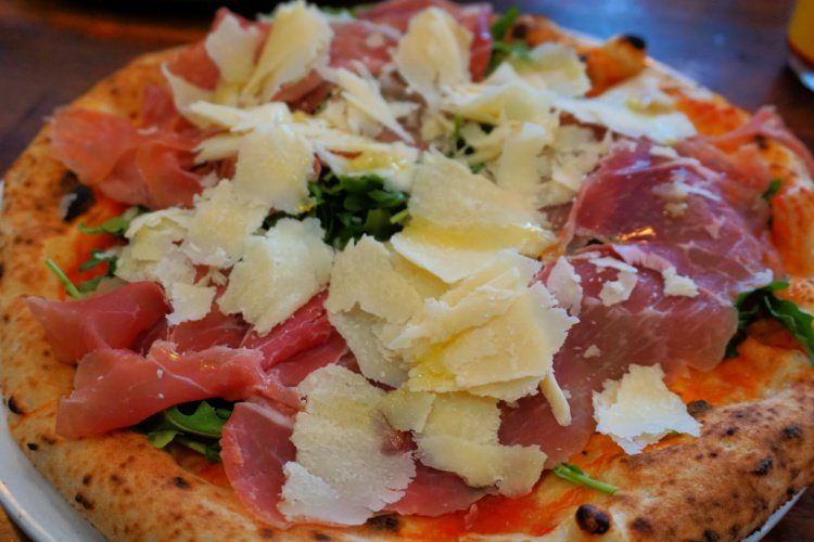 Arugula, prosciutto and Parmesan pizza in North Beach, San Francisco, California